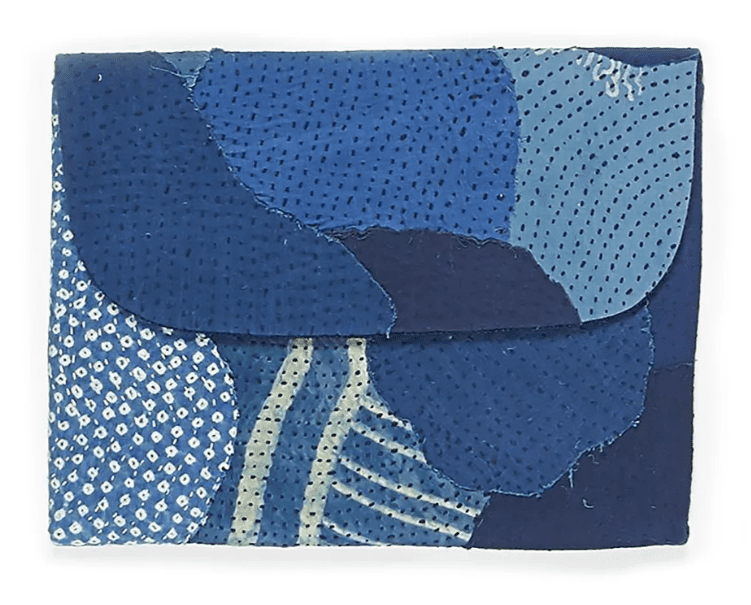 Reclaimed Accessories by 11.11 : Patched laptop sleeve made with made out of the left over scrap fabrics